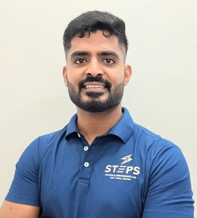 Sunil Kumar M smiling in athletic wear