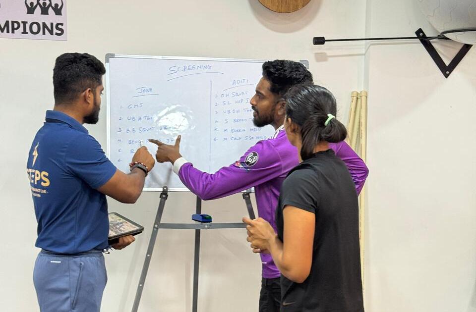 Physiotherapist assessing an athlete’s movement